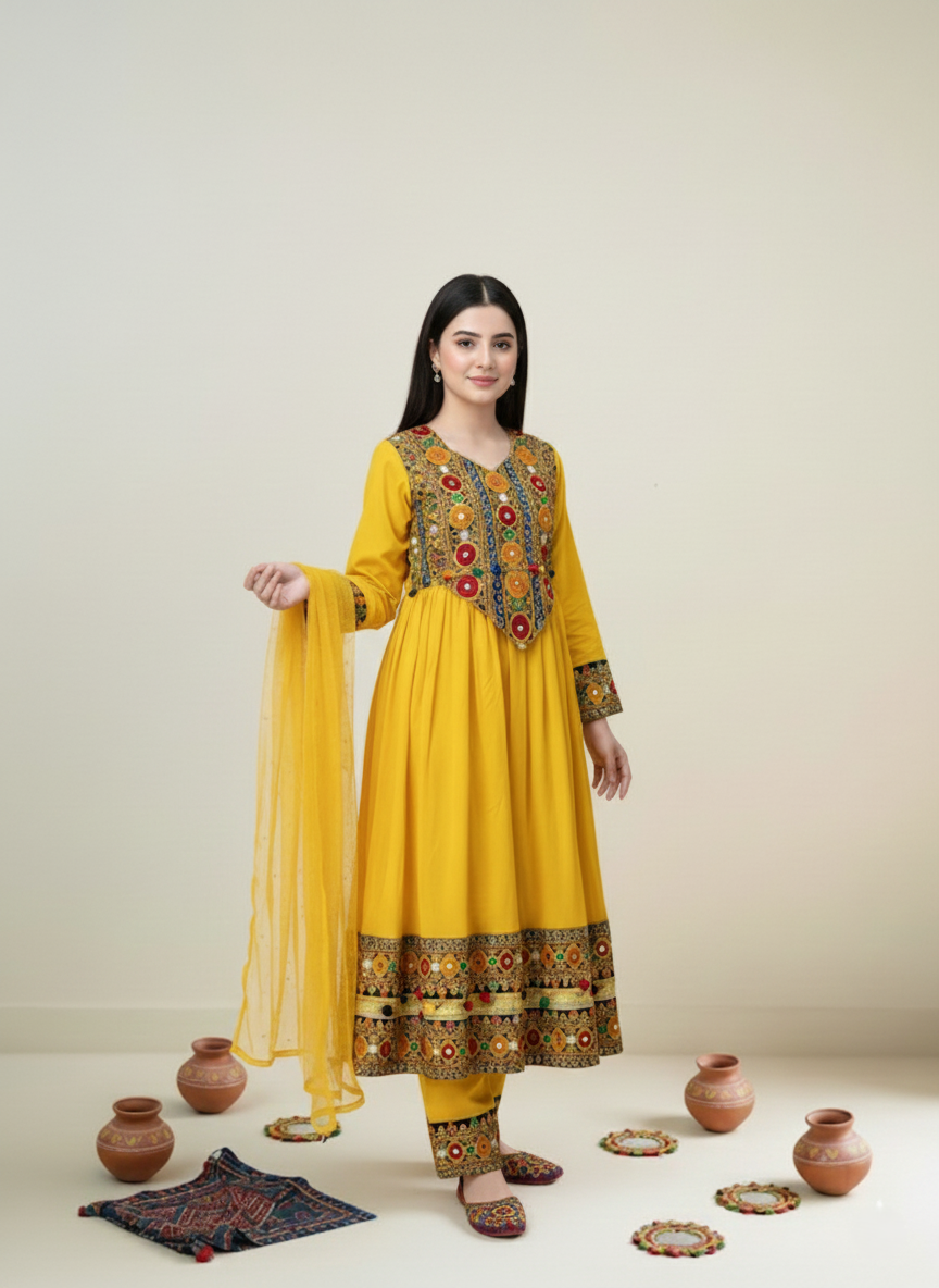 Woman wearing a yellow embroidered traditional outfit with a plain background