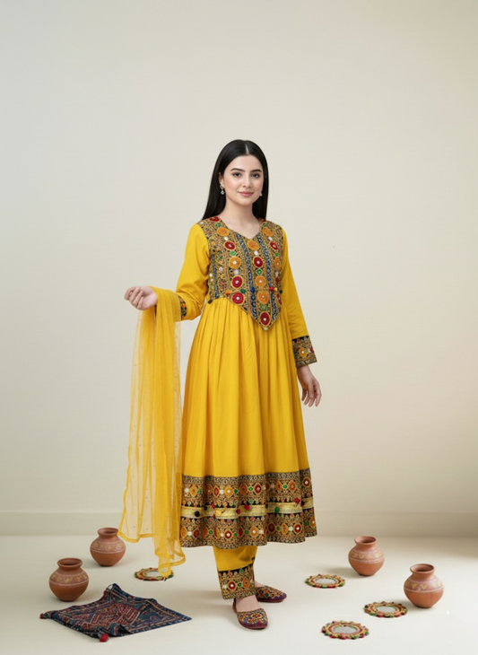 Woman wearing a yellow embroidered traditional outfit with a plain background