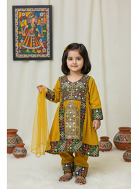 Young girl in a traditional embroidered outfit with a colorful painting in the background