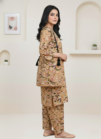 Woman wearing a patterned outfit in a minimalistic room.