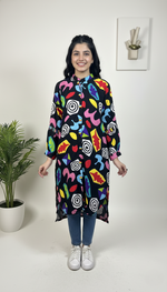 Woman wearing a colorful patterned dress on a white background