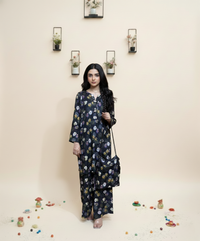 Woman wearing a floral dress holding a bag against a neutral background