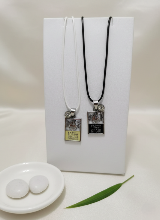 Two necklaces with pendant tags on a white background