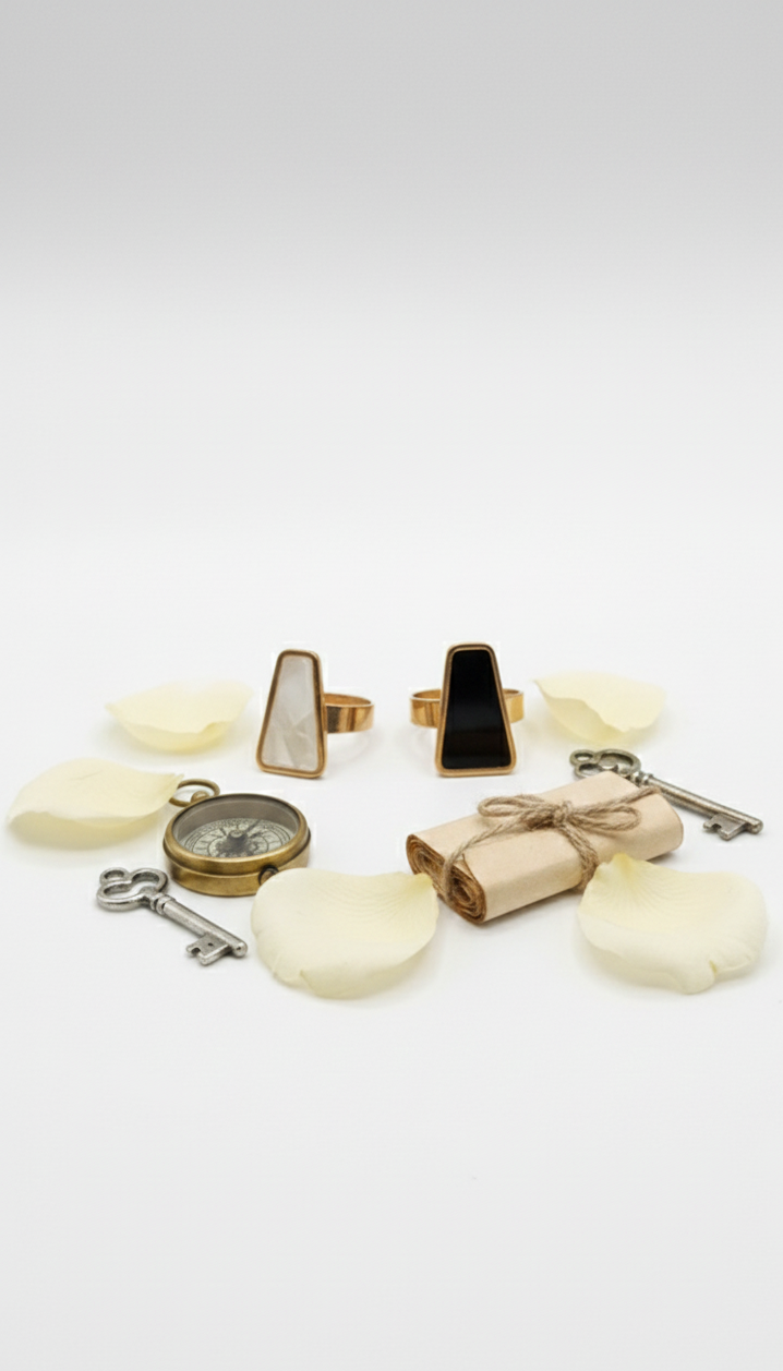 Collection of decorative items including a compass, key, and soap on a white background